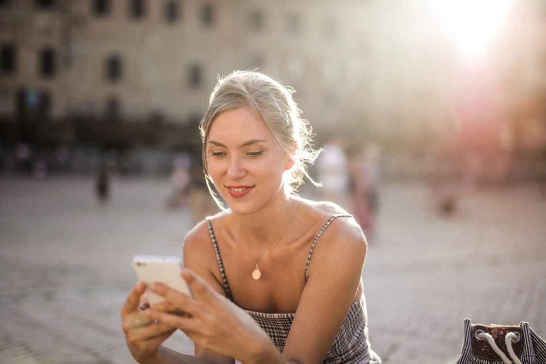 Woman Holding a White phone